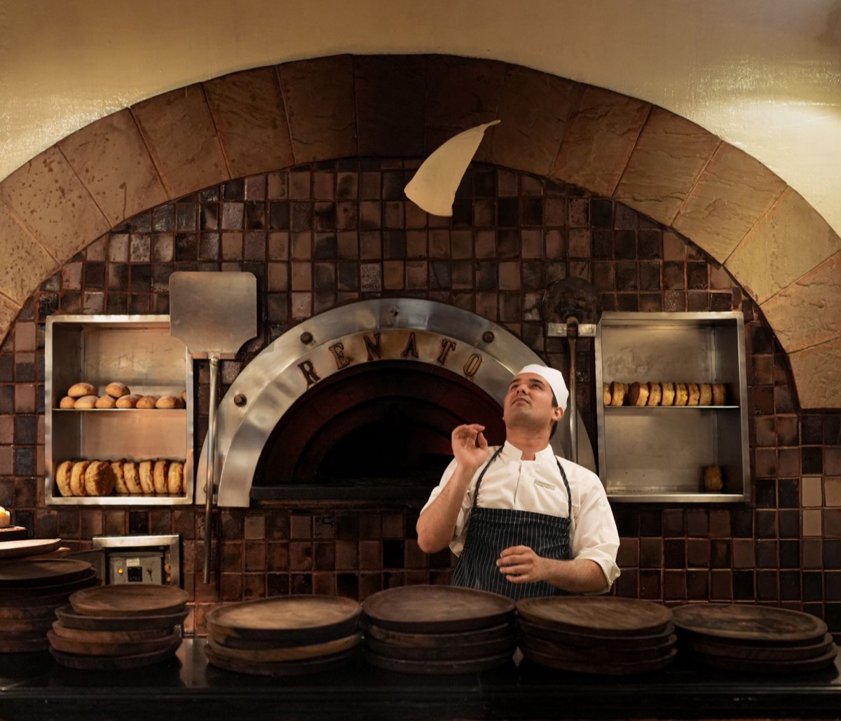 italian chef in modern kitchen