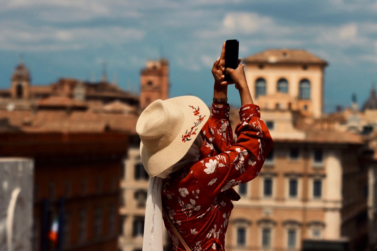 italian influencer on smartphone