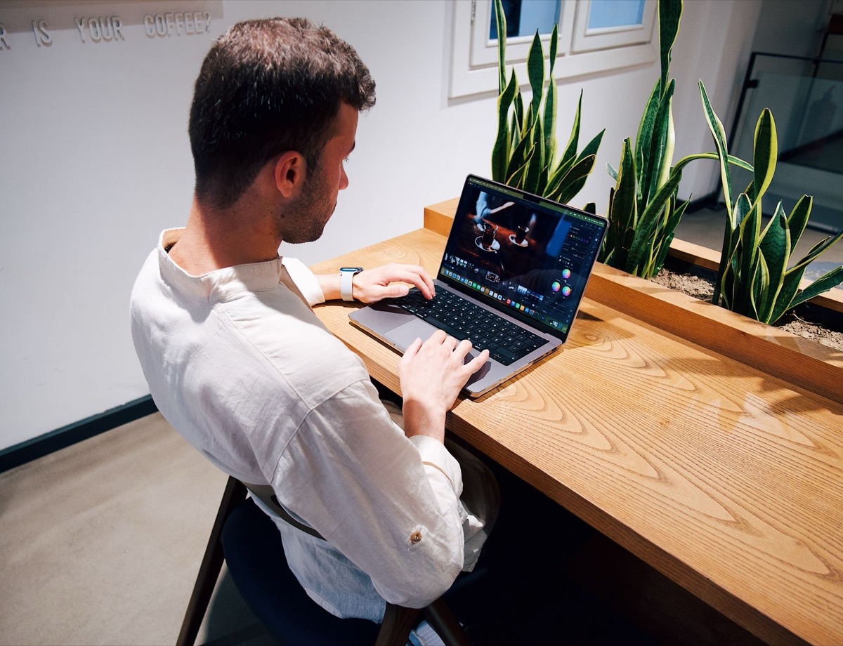 Italian designer working on digital projects in modern office